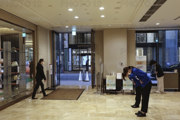 Entrance area of an elegant shopping center with visitors, Tokyo, Ginza, Chuo, Japan