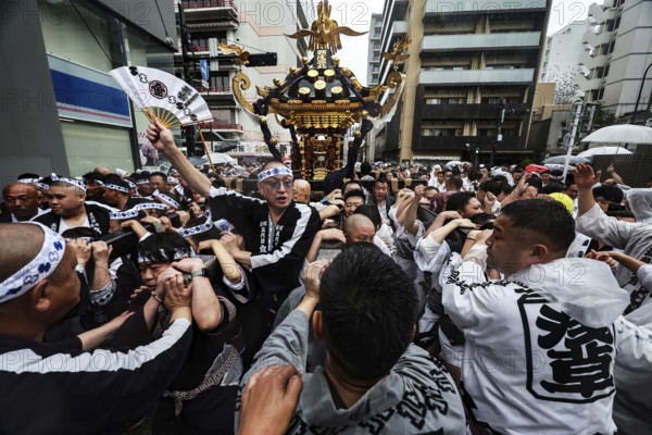 Busy festival in the streets of Asakusa, energetic crowd at Sanja Matsuri, Tokyo, Asakusa, Japan