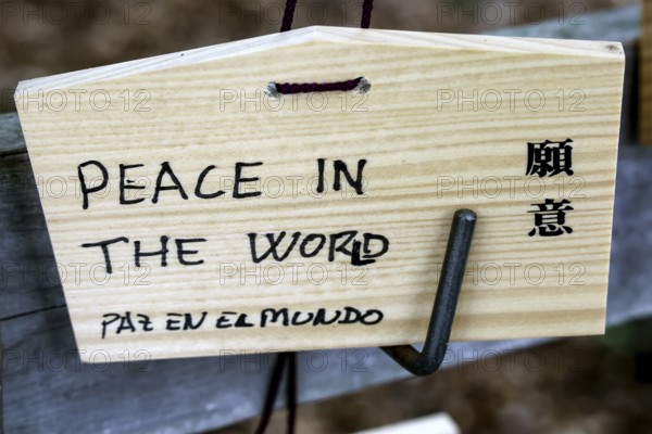 Wooden wish plate at Meiji Shrine in Tokyo with wish for peace inscribed in English, Tokyo, Japan