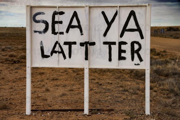Ironic sign in a lonely desert area, dry and funny atmosphere, zero