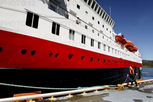 Worker prepares to sail a Hurtigruten ship in Kirkenes, Kirkenes, Finnmark, Norway
