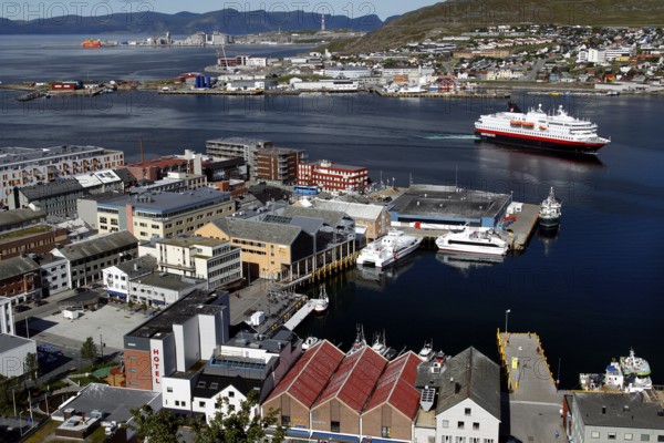 Hurtigruten ship docks in the busy port of Hammerfest, Hammerfest, Finnmark, Norway