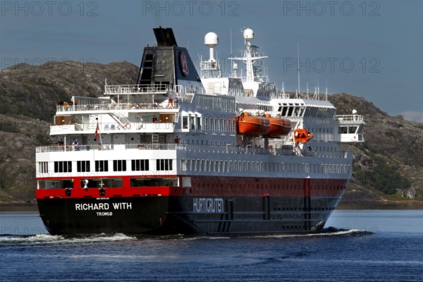 Hurtigruten ship sails through rocky landscape, Kirkenes, Finnmark, Norway