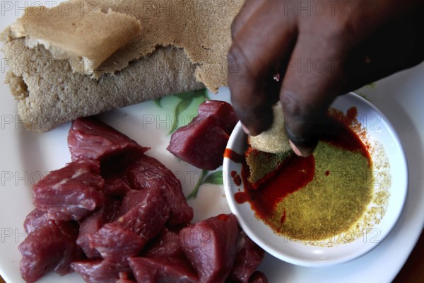Tire Siqa served with raw meat and injera in Debark, Debark, Amhara, Ethiopia