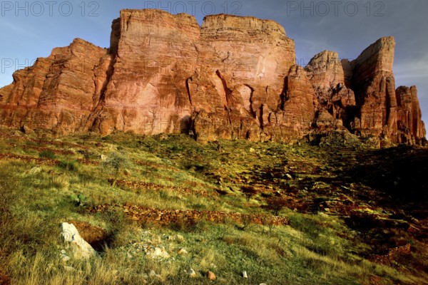 Massive rock formation in the Gheralta Mountains with vivid colors in the vegetation, zero
