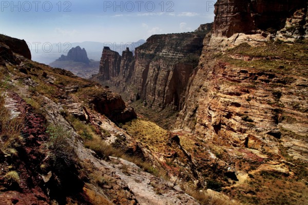 Dramatic rock formations in the arid Gheralta Mountains with sparse vegetation
