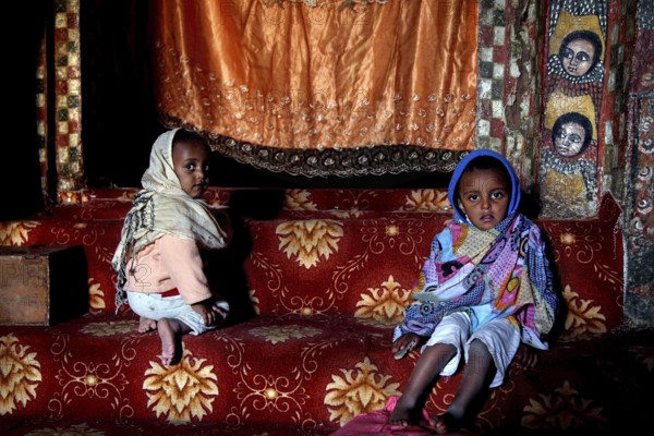 Two children in the traditional setting of Debre Berhan Selassie church, zero