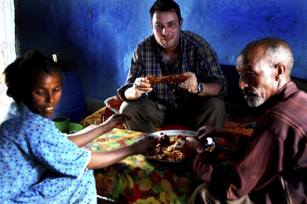 Visiting Chuchu's family in Lalibela, eating together in a cozy atmosphere, Lalibela, null