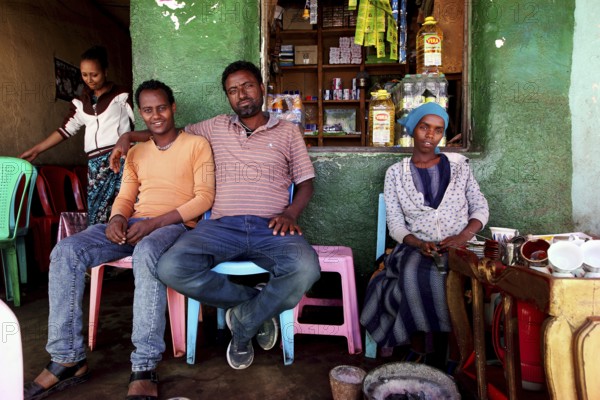 People in a cozy cafe in Kulubi during a coffee ceremony, Kulubi, zero