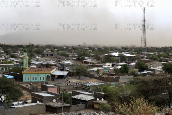 Panoramic view of a city with minaret and transmission tower, Kwila, Ethiopia