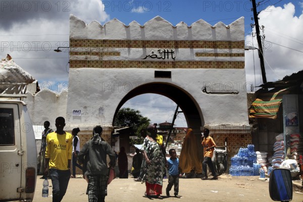 The historic Shoa Ber western gate of Harar with people in front of it, Harar, Harari, Ethiopia