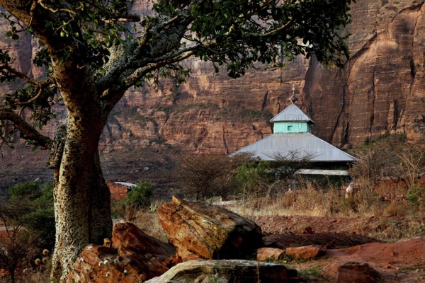 Traditional church in Hawzien nestled in impressive rocky landscape, Hawzien, Tigray, Ethiopia