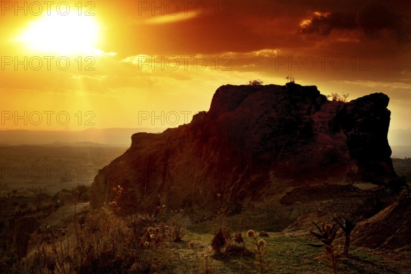 Rock formation at sunset creates a breathtaking landscape with golden sky tones, Hawzien, Tigray, Ethiopia