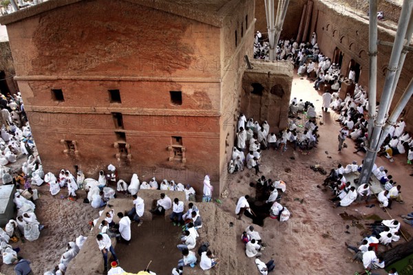 People gather around Bete Maryam church during a ceremony, Lalibela, Ethiopia
