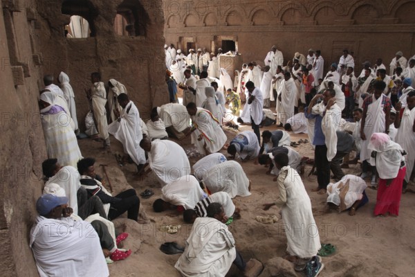 Men pray during a religious ceremony for Easter in Bete Maryam, Lalibela, Ethiopia