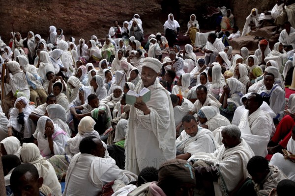 Believers in white robes gather for an Easter service in Bete Maryam, Lalibela, Ethiopia