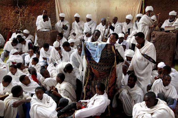Many in white robes gather for a festive Easter service in Bete Maryam, Lalibela, Ethiopia