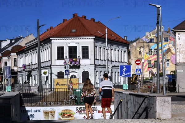 Vilnius Gatve in Kaunas with pedestrians and colorful buildings under blue sky, Kaunas, Kaunas, Lithuania