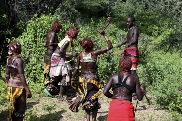 Hamer woman take part in a whipping ritual to show strength, Turmi, Ethiopia
