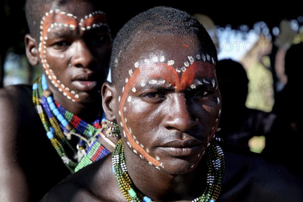 Close-up of Hamer men with artistic face painting, Turmi, Ethiopia