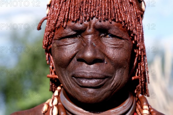 Hamer woman wearing traditional jewelry in Turmi village, Turmi, Ethiopia
