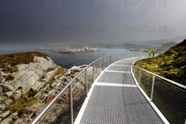 Eldhusøya viewpoint along Atlanterhavsveien with sea views and dramatic clouds, Lauvøyford, Møre og Romsdal, Norway
