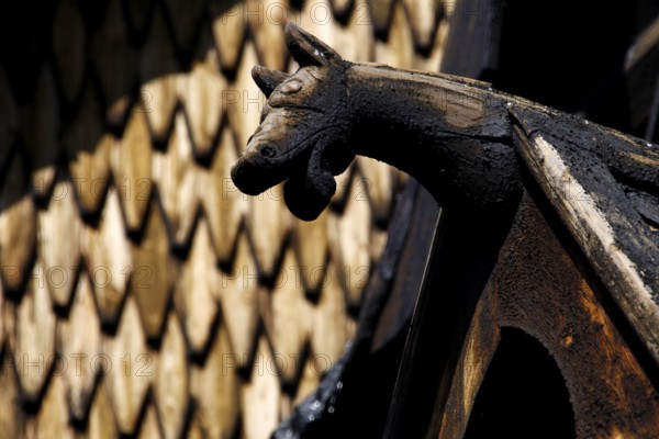 Roof figure of a stave church in Heddal with detailed wood carving, Heddal, Notodden, Norway