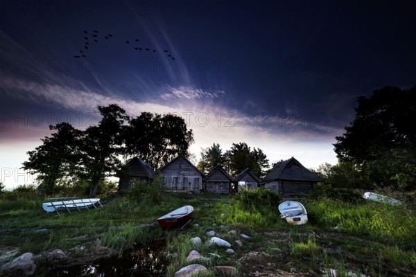 Romantic fishing sheds on Altja beach at dusk, Altja, Estonia