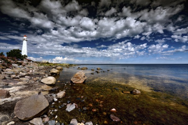 A lighthouse on the rocky coast of Tahkuna with impressive skies, Hiiumaa, Tahkuna, Estonia