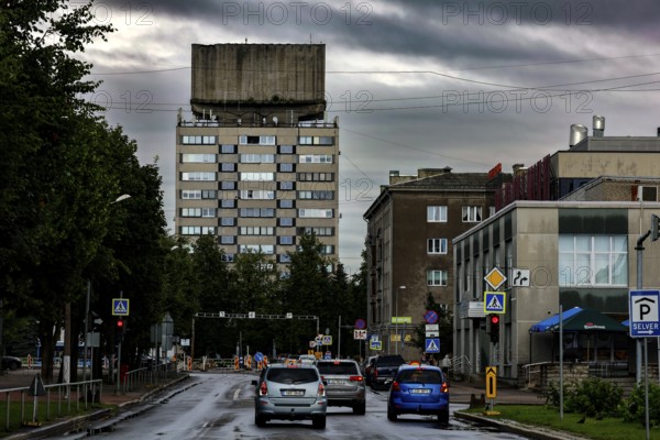 View of a Soviet high-rise building on Paul Kerese Street in Narva, surrounded by cloudy sky, Narva, Estonia