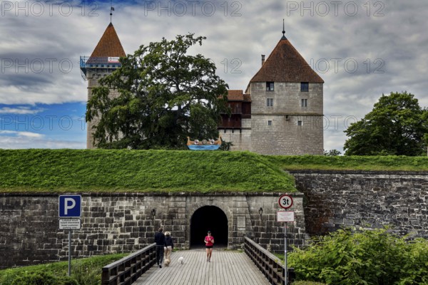 Impressive medieval castle complex with towers and entrance through a stone wall, Kuressaare, Saaremaa, Estonia