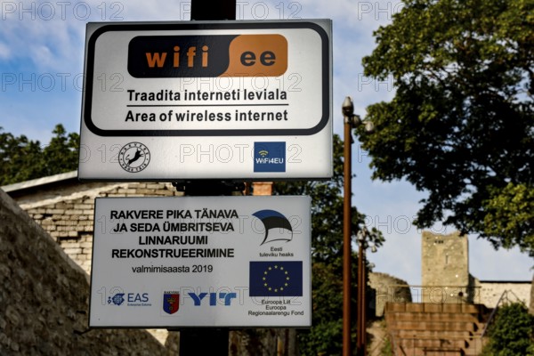 WiFi sign in Rakvere with a tree and a city wall in the background, Rakvere, null, Estonia