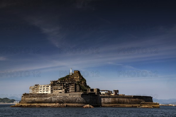 Ruined city on Hashima island known as Gunkanjima seen from the sea, Nagasaki, Kyushu, Japan