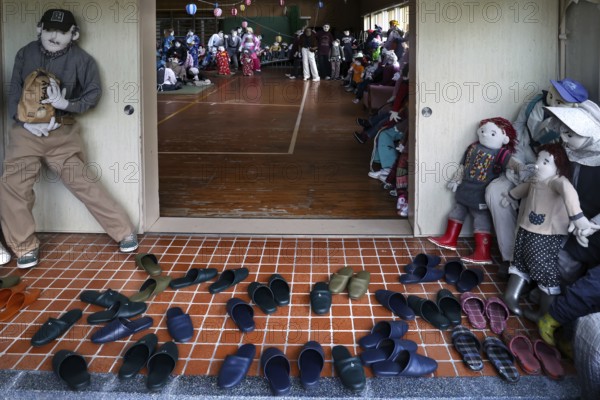 Entrance to a hall with rag dolls and lined shoes, Nagoroshimo, Japan