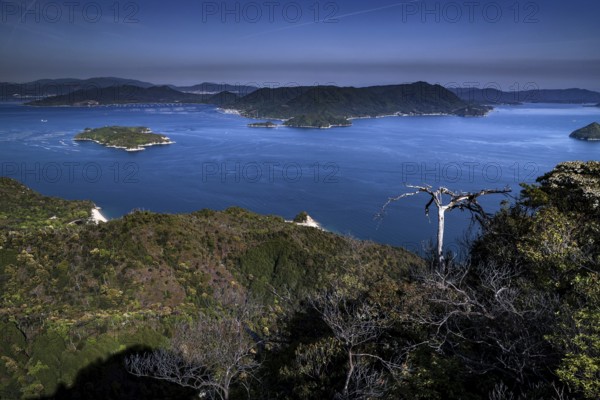 View from Mount Misen of a vast bay with several islands under a blue sky, Miyajima, Hiroshima, Japan