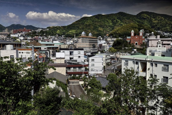 City view of Urakami with hills in the background, dense buildings, Nagasaki, Japan