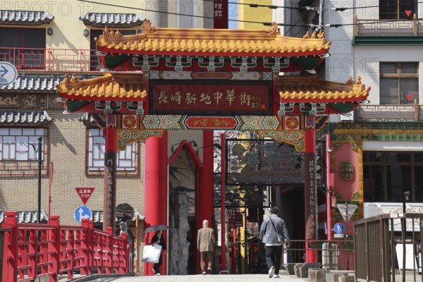 Traditional gate in Nagasaki's Chinatown with ornate roofs and bright colors, Nagasaki, Kyushu, Japan