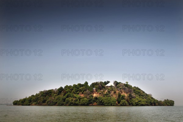 Green island surrounded by the clear water of Lake Tana, Lake Tana, Amhara, Ethiopia