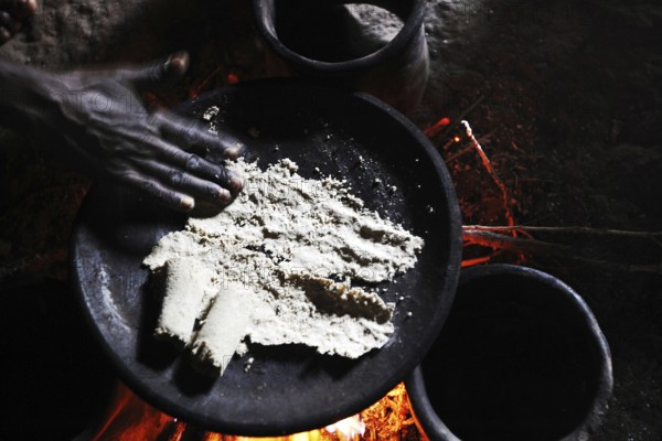 Traditional cooking on a fireplace in a hut, Yirga Alem, Ethiopia