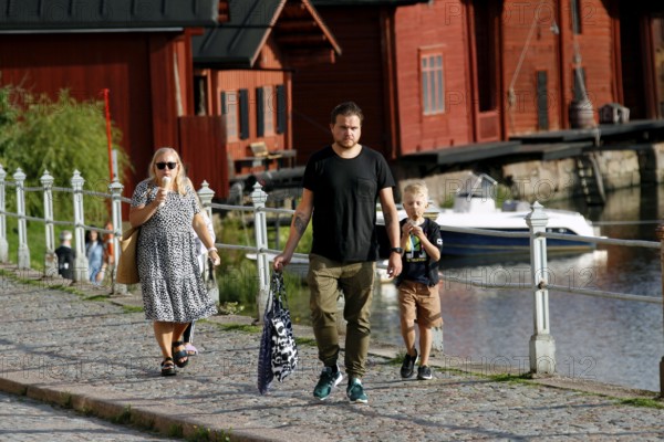 People walking in Porvoo's old town and eating ice cream, Porvoo, Finland