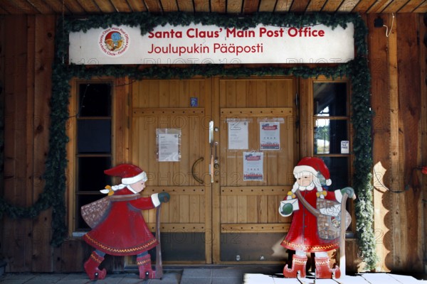 Santa Claus Village Post Office wooden building with festive Santa Claus decoration, Napapiiri, Finland