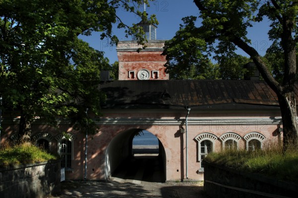 Suomenlinna sea fortress barracks and gate surrounded by trees, Helsinki, Uusimaa, Finland