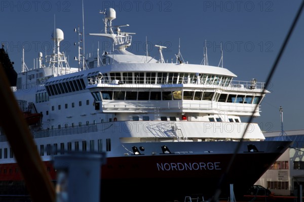 Hurtigruten ship in Svolvær harbour on Austvågøy under blue sky, Svolvær, Austvågøy, Norway