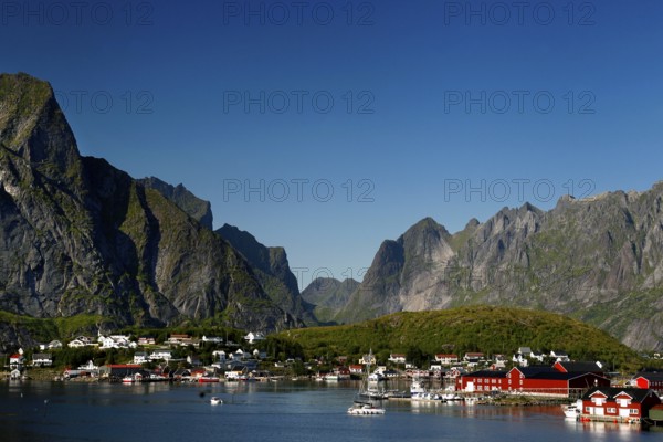Reine on the coast with picturesque mountains and clear waters of Lofoten, Reine, Moskenesøy, Norway