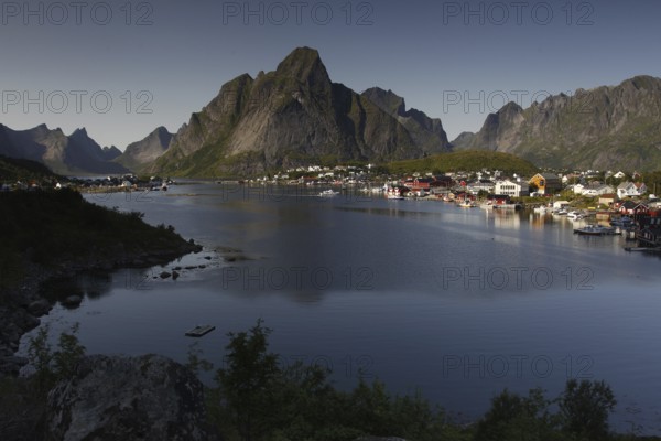 View of Reine and Hamnøay with water and impressive mountain scenery of Lofoten, Reine, Moskenesøy, Norway
