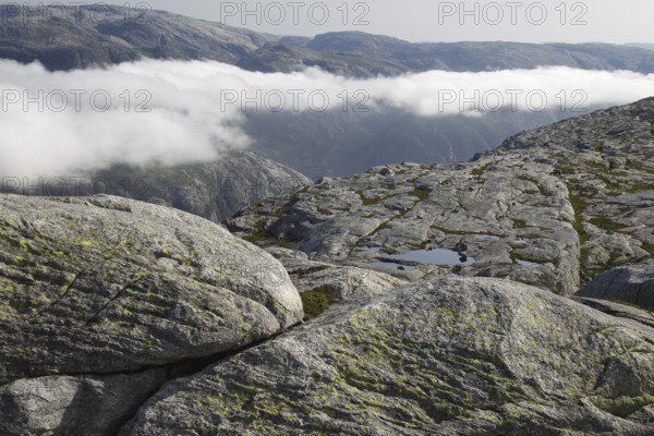 Wide rocky landscape with cloud cover over the Kjerag Plateau, Lysefjord, Rogaland, Norway