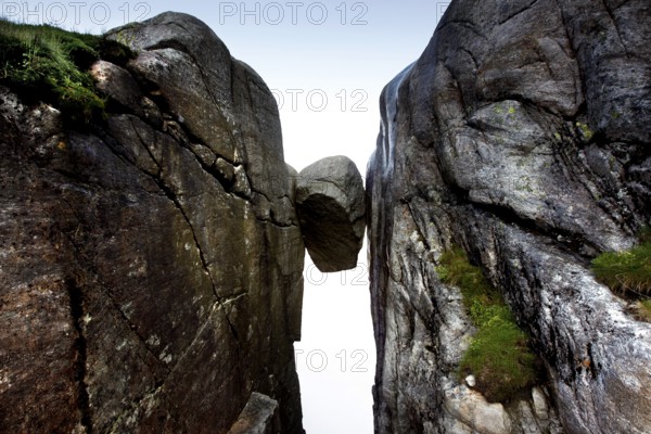 Kjeragbolten, a large rock sandwiched between vertical rock walls, Kjerag, Rogaland, Norway
