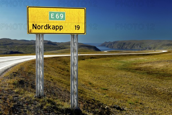 Road sign to the North Cape on the E69 in front of a vast landscape, Nordkapp, Magerøya, Norway