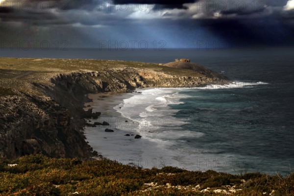 The dramatic coastline of Cape du Couedic with strong swell under dark skies, Kangaroo Island, South Australia, Australia