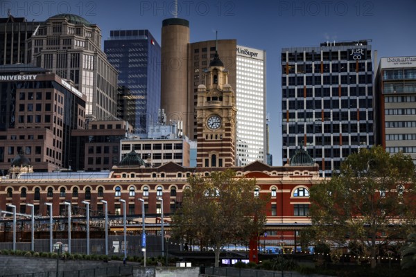 Flinders Street Station in Melbourne with surrounding modern buildings, Melbourne, Victoria, Australia
